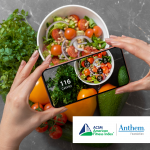 hands holding a nutrtion app scanning a bowl of salad